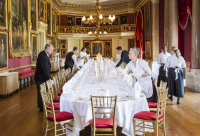 Sarah White, female butler, David Edney head butler and others serving the table at great hall Godwood House, Chichester, West Sussex, UK, Europe