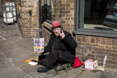 Homeless Man holding Big Issue with Florence Nightingale Warhol style Cover
