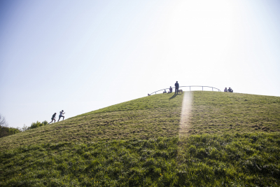 People running up Stave Hill,  Good Friday, North Rotherhithe,